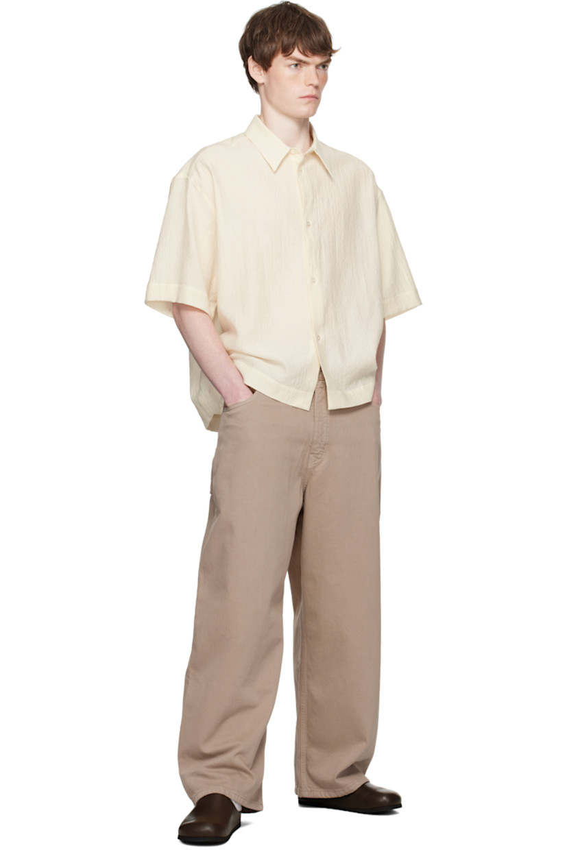 Garment-dyed non-stretch denim jeans.

· Tapered and wide-leg
· Belt loops
· Five-pocket styling
· Zip fly
· Leather logo patch at back waistband

Supplier color: Fawn