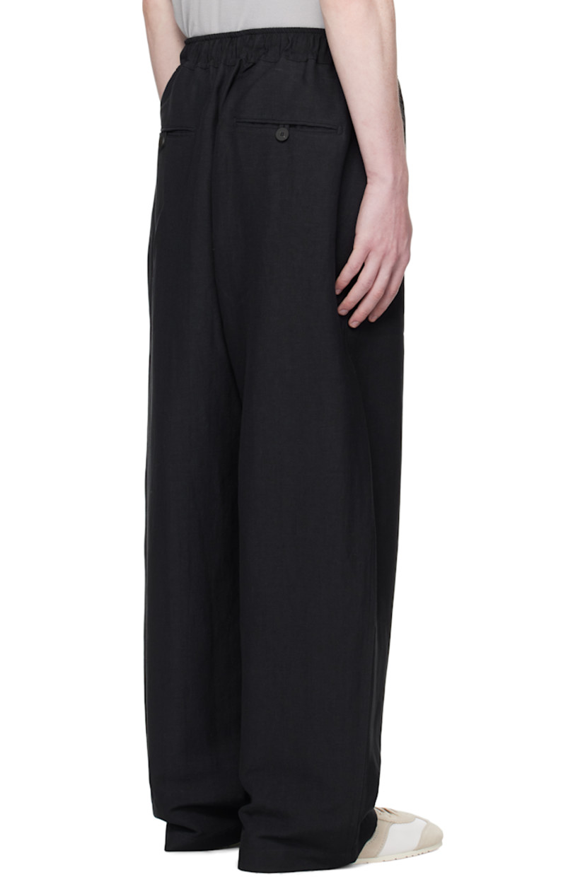 Linen- and wool-blend hopsack trousers.

· Loose-fit
· Drawstring at elasticized waistband 
· Four-pocket styling
· Mock fly

Supplier color: Darkest navy