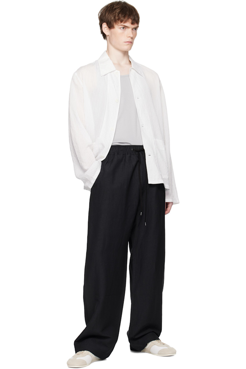Linen- and wool-blend hopsack trousers.

· Loose-fit
· Drawstring at elasticized waistband 
· Four-pocket styling
· Mock fly

Supplier color: Darkest navy