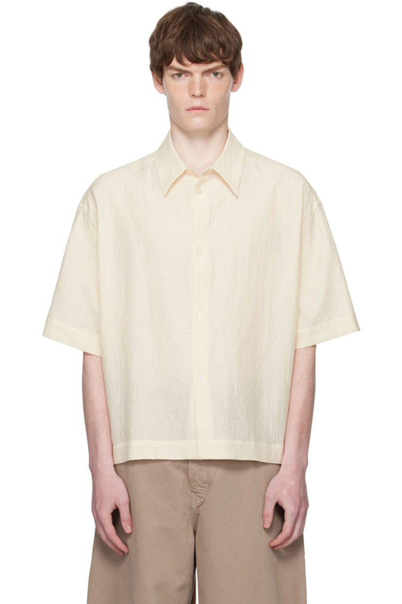 Cotton-blend matelassé shirt.

· Oversized
· Spread collar
· Button closure
· Dropped shoulders
· Twin pleats at back yoke

Supplier color: Milk