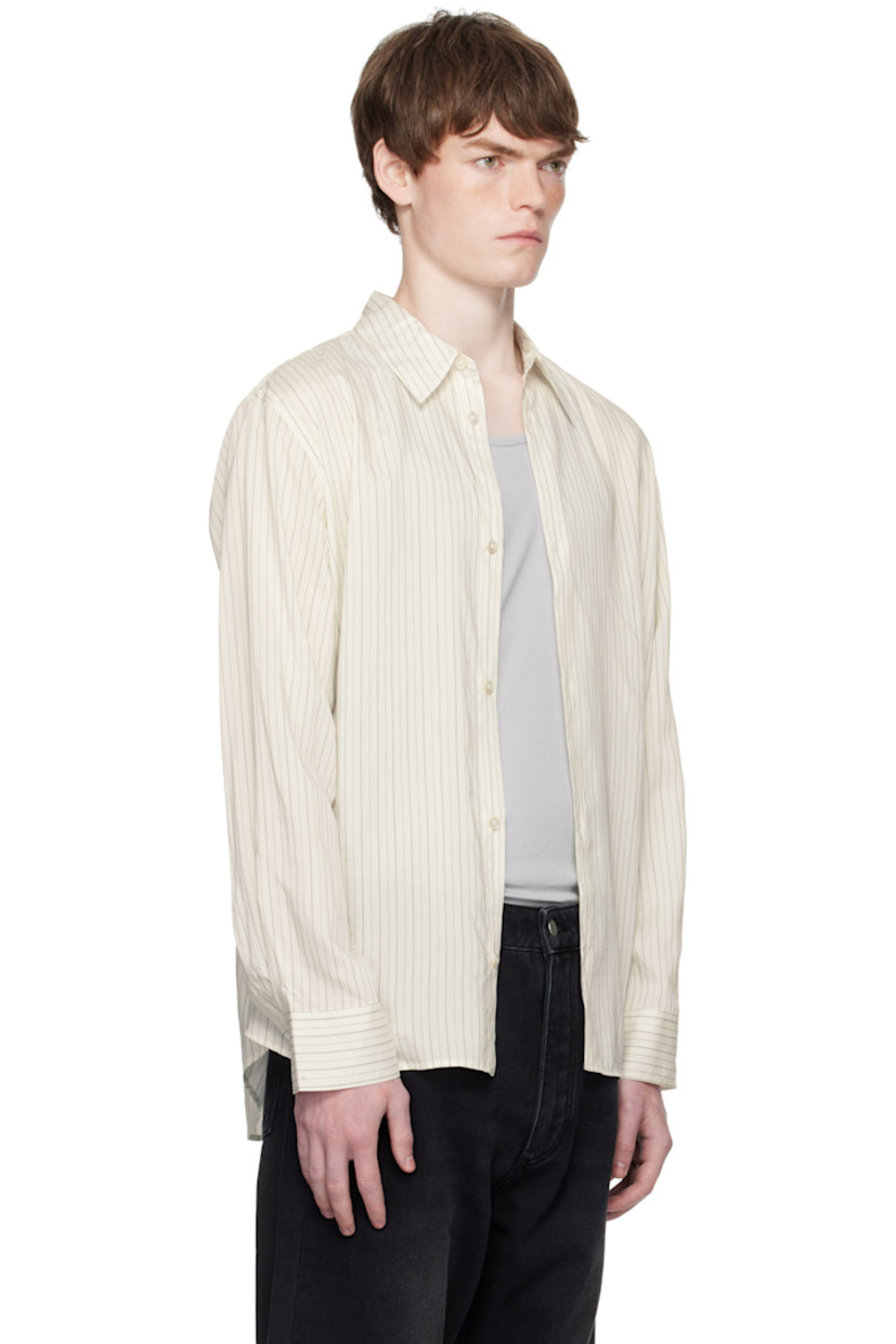 Silk-blend poplin shirt.

· Stripes throughout
· Spread collar
· Button closure
· Shirttail hem
· Buttoned barrel cuffs
· Twin pleats at back yoke

Supplier color: Ecru/Black stripe
