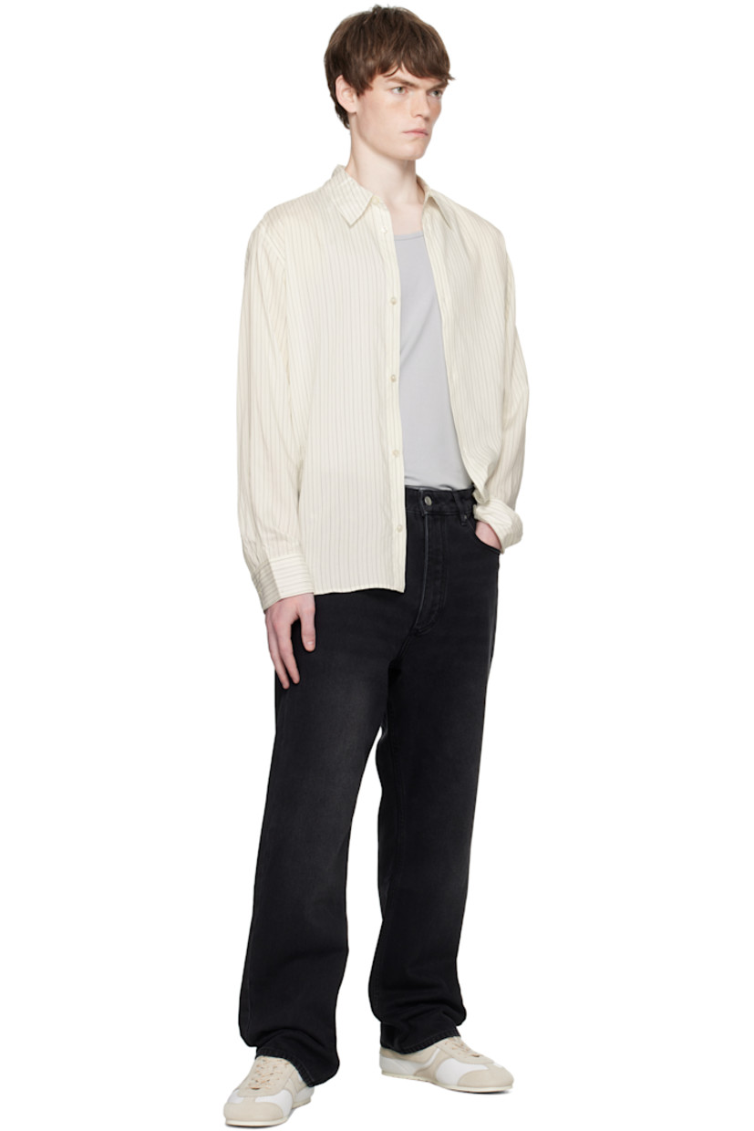 Silk-blend poplin shirt.

· Stripes throughout
· Spread collar
· Button closure
· Shirttail hem
· Buttoned barrel cuffs
· Twin pleats at back yoke

Supplier color: Ecru/Black stripe