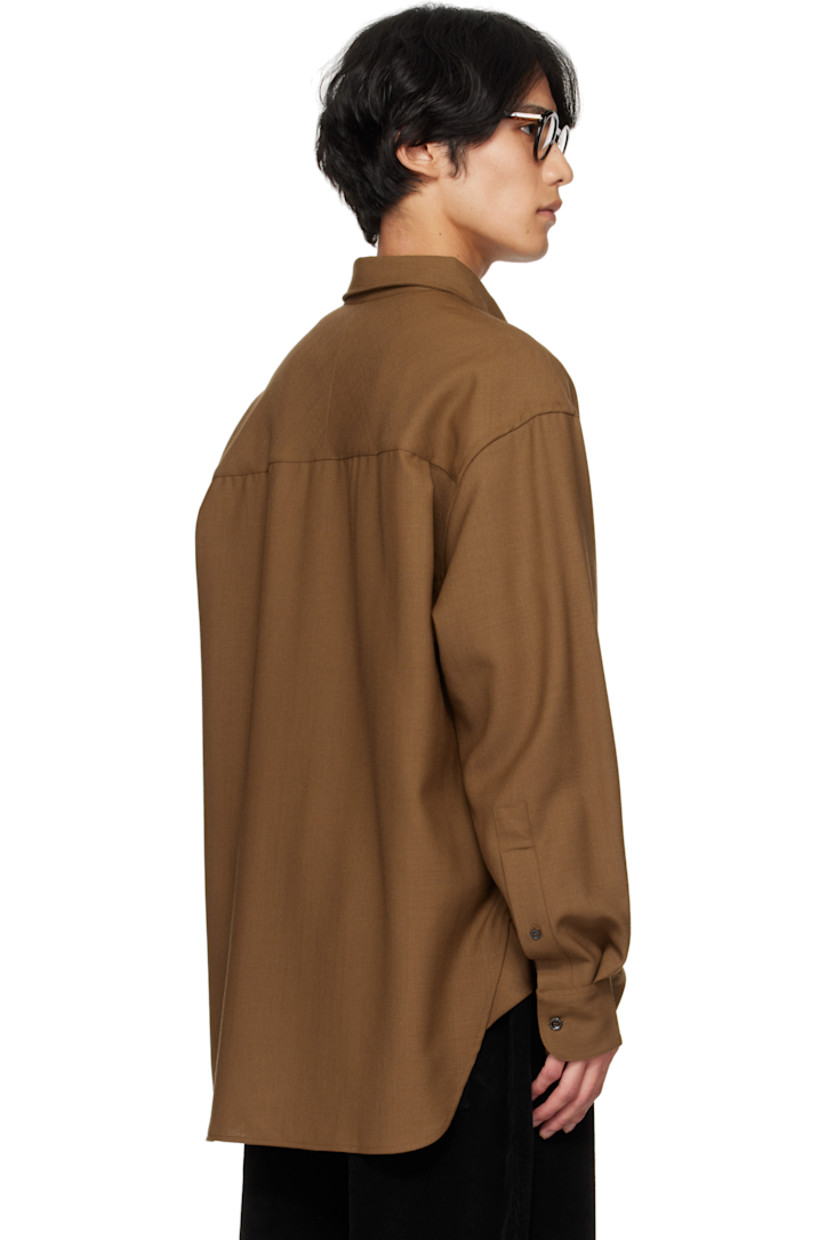 Wool hopsack shirt.

· Spread collar
· Button closure
· Shirttail hem
· Buttoned barrel cuffs
· Pleats at back yoke

Supplier color: Tobacco