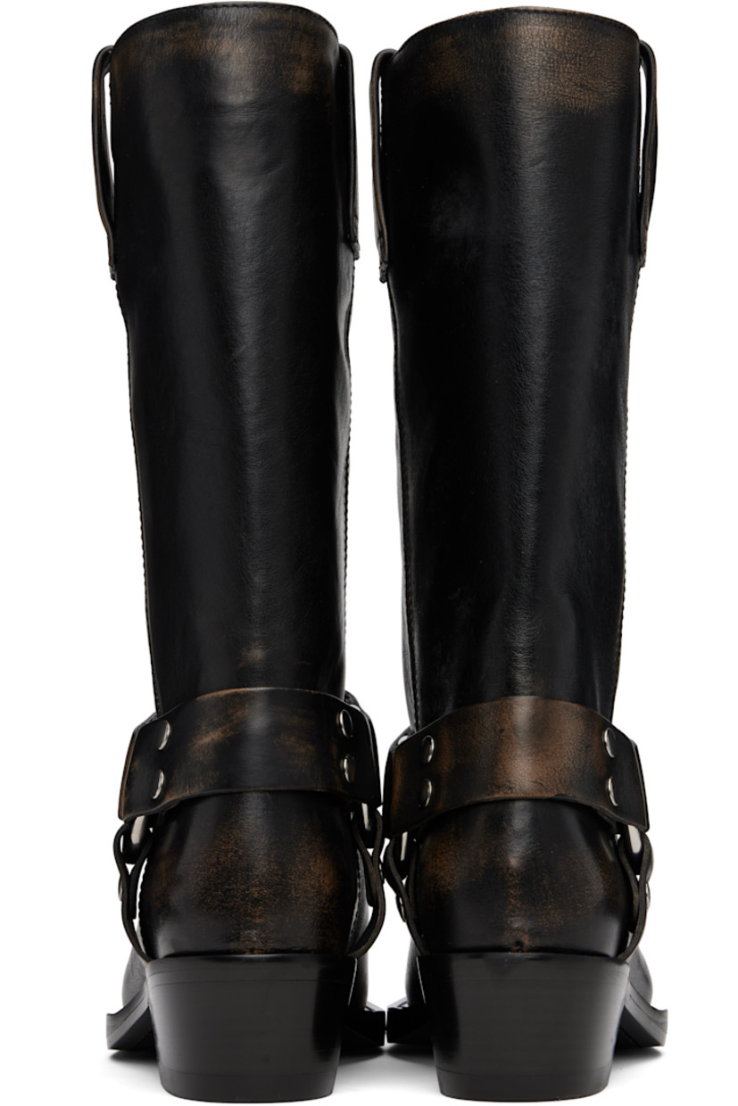 Mid-calf brushed leather boots in black.

· Square toe
· Harness-style straps at sides
· Pull-loops at collar
· Buffed leather lining
· Stacked leather block heel with rubber injection
· Leather sole
· Heel: H2"

Supplier color: Black