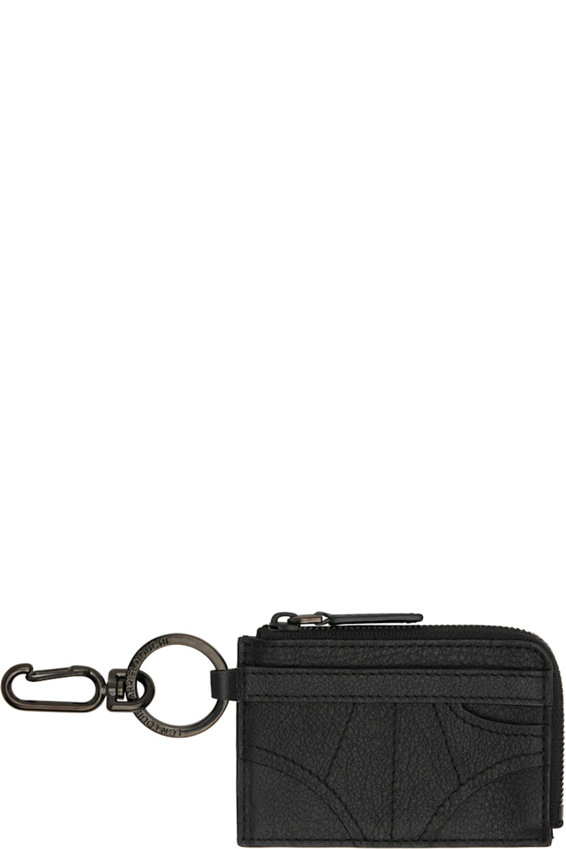 Grained leather card holder.

· Graphic appliqué at face
· Clasp and keyring at side
· Logo embossed at back face
· Two card slots
· Zip coin compartment
· H2.75" x W3.75"

Supplier color: Black