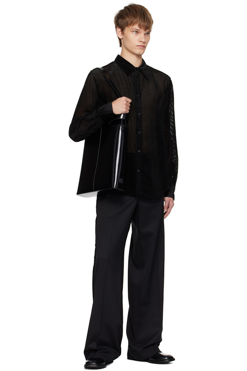 Semi-sheer viscose-blend voile shirt. 

· Stripes flocked throughout
· Spread collar
· Button closure
· Shirttail hem
· Buttoned barrel cuffs
· Pleats at back yoke

Supplier color: Devored stripes