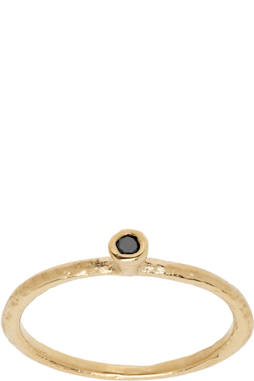 Band ring in 14k gold. Bezel-set 0.02 ct black diamond at face.

Supplier color: 14k yellow gold/Black diamond
