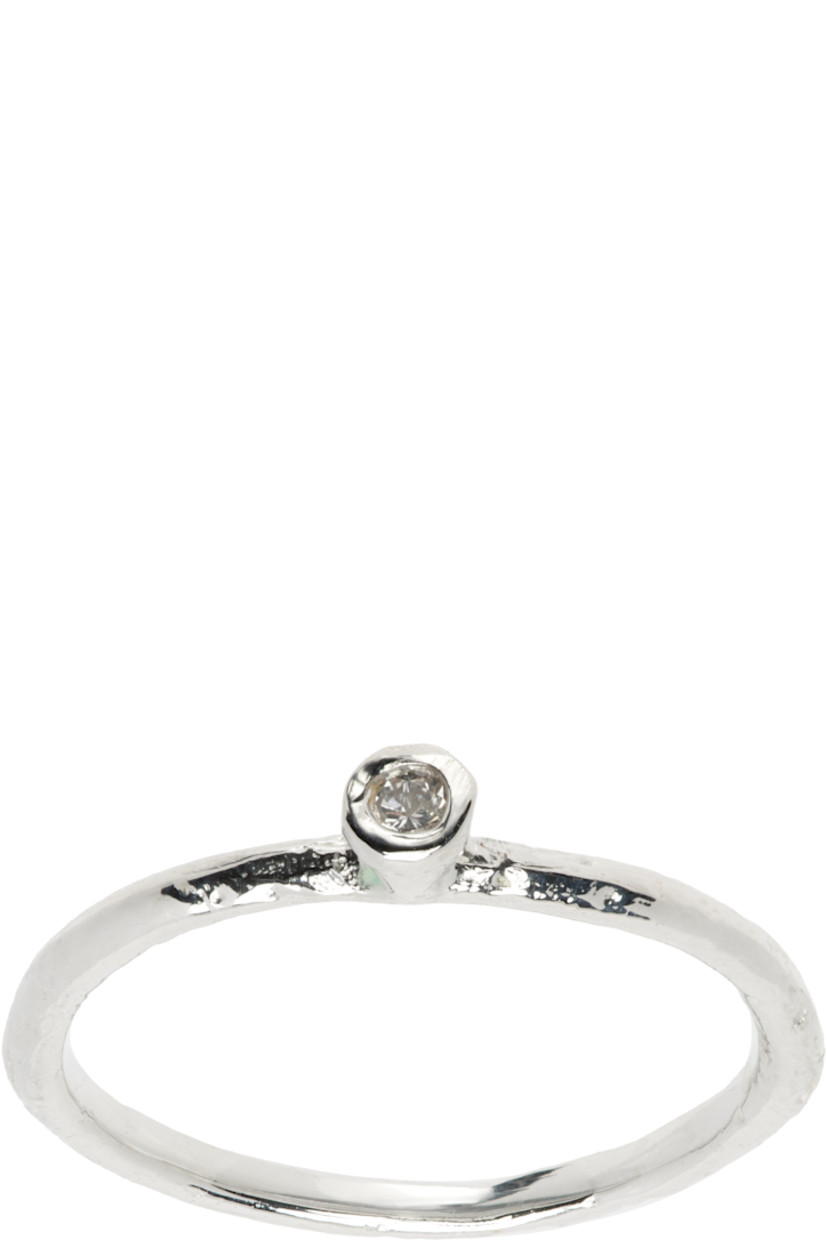 Band ring in sterling silver. Bezel-set 0.02 ct diamond at face.

Supplier color: 925 silver/2mm white diamond