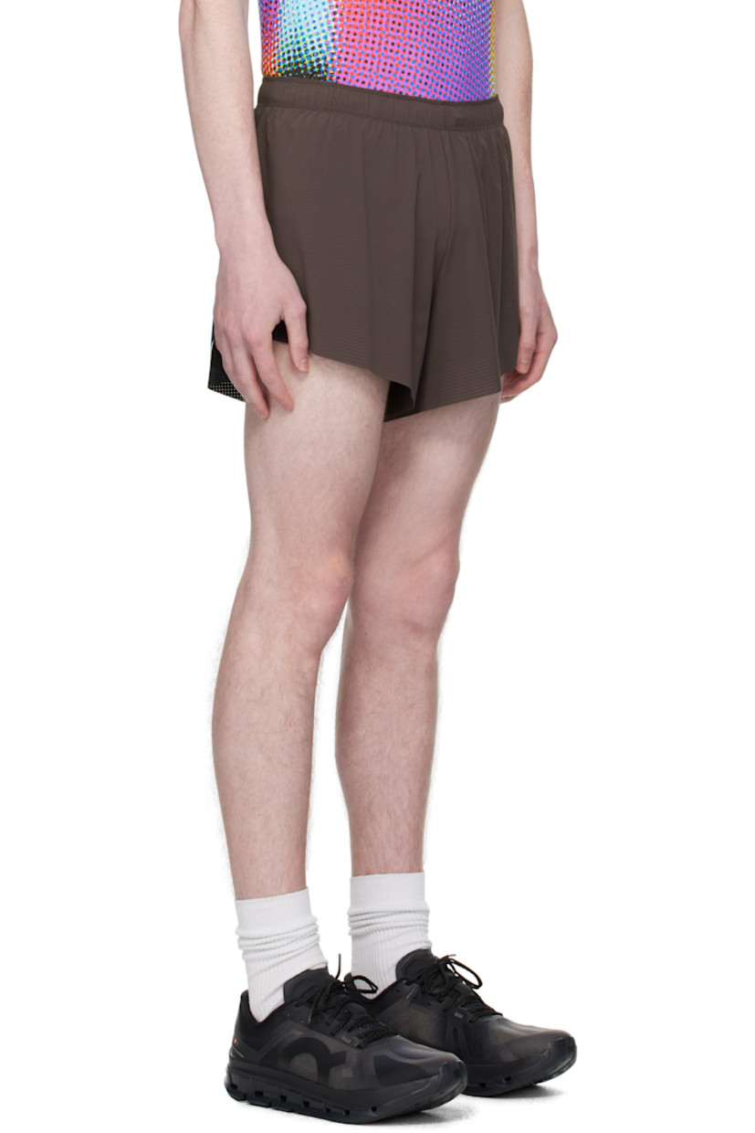 4-way stretch jersey shorts. 

· Lightweight and quick-drying
· Bonded seams throughout
· Concealed drawstring at elasticized waistband
· Vented outseams
· Laser-cut perforations and reflective trim at back
· Bonded logo patch at back
· Zip pocket at back waistband
· Briefs-style stretch jersey lining

Supplier color: Grey/Black