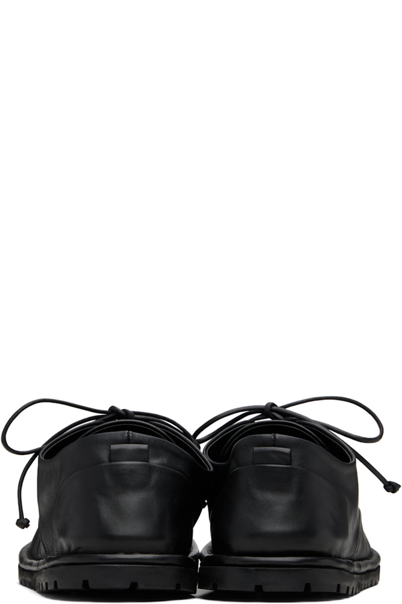 Buffed leather derbys.

· Lace-up closure
· Pull-loop at heel counter
· Topstitching at welt
· Treaded rubber sole

Supplier color: Black