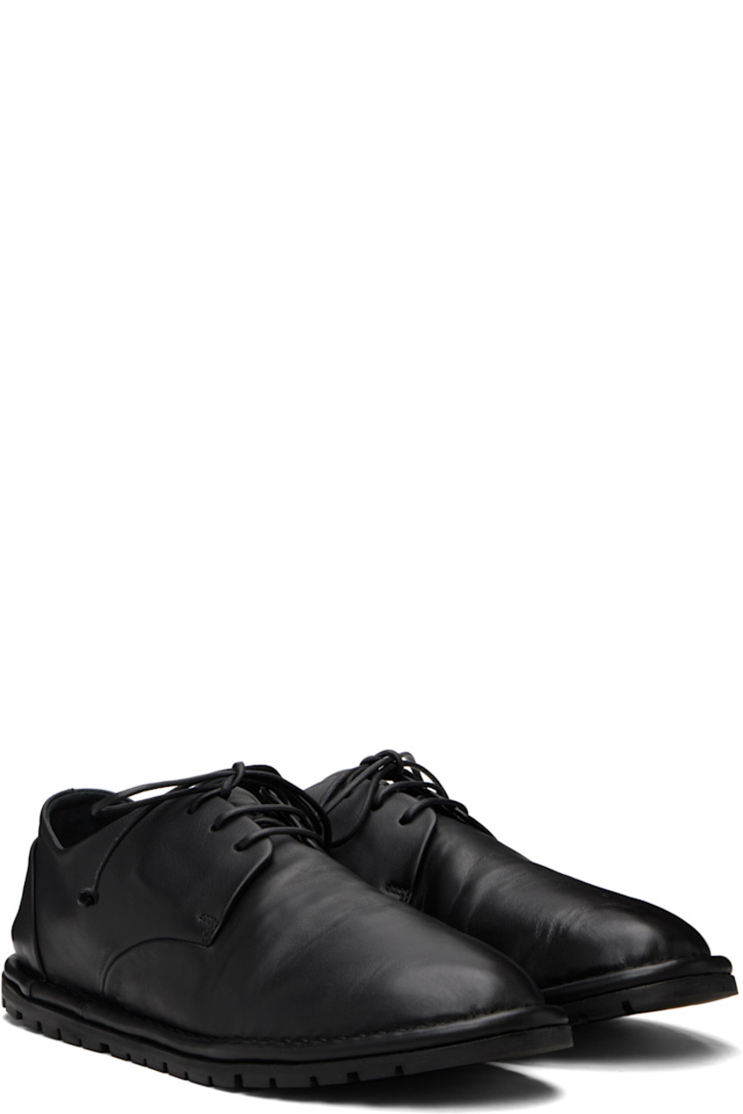 Buffed leather derbys.

· Lace-up closure
· Pull-loop at heel counter
· Topstitching at welt
· Treaded rubber sole

Supplier color: Black