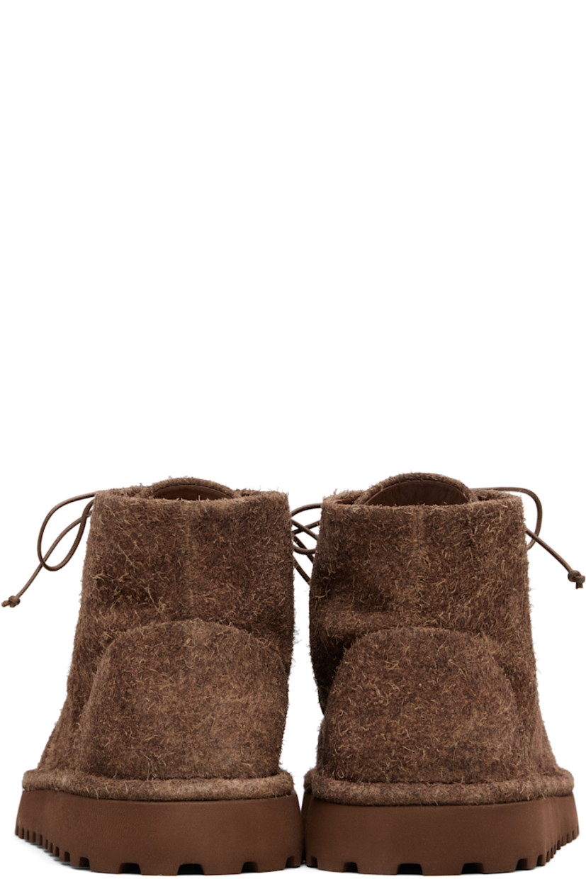 Ankle-high brushed suede boots.

· Lace-up closure
· Suede and leather lining
· Treaded rubber sole

Supplier color: Dark brown