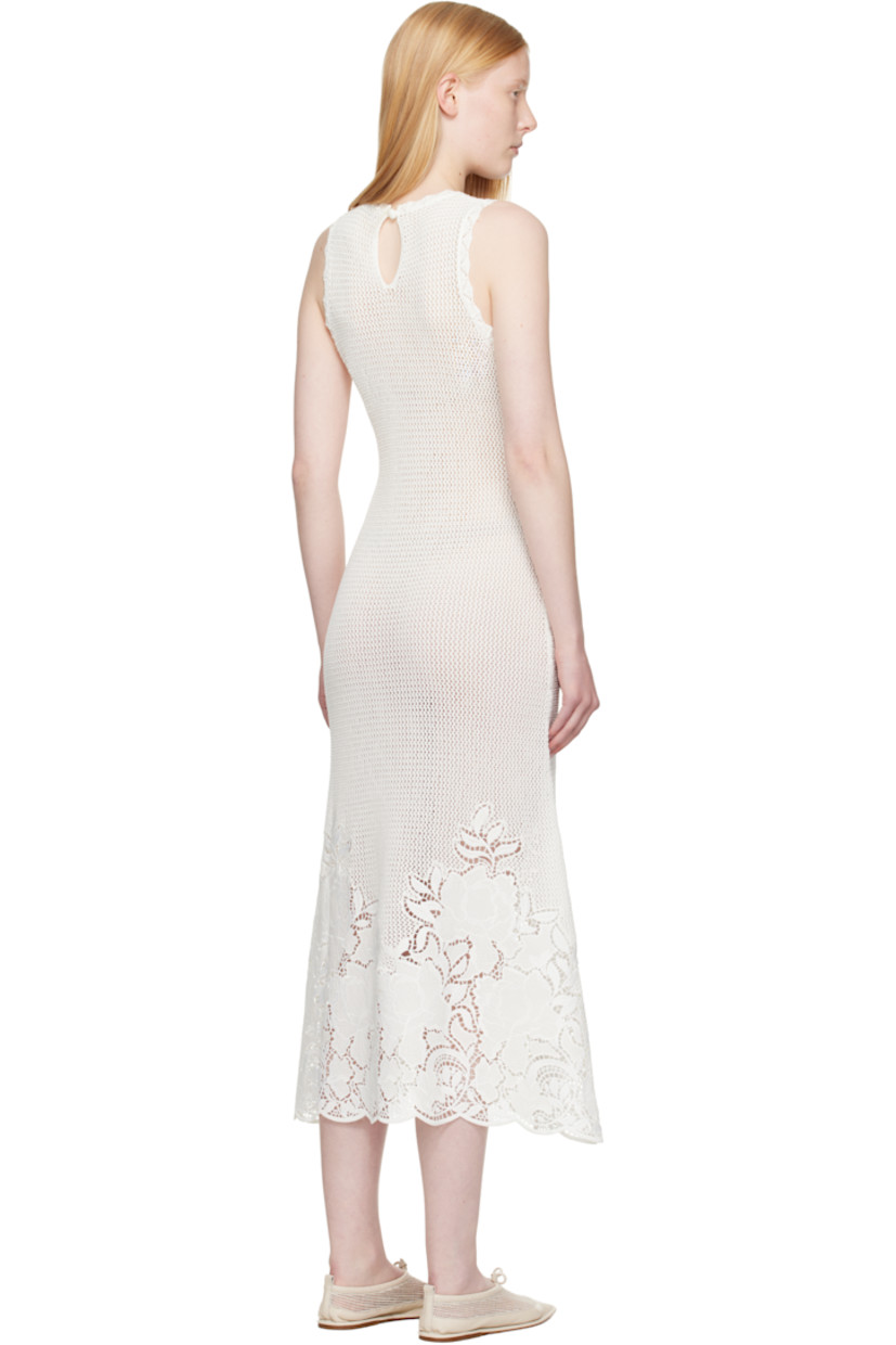 Semi-sheer open-knit mercerized cotton midi dress. Scalloped edges throughout.

· Crewneck
· Broderie anglaise detailing at hem 
· Keyhole with button fastening at back collar

Supplier color: Ivory