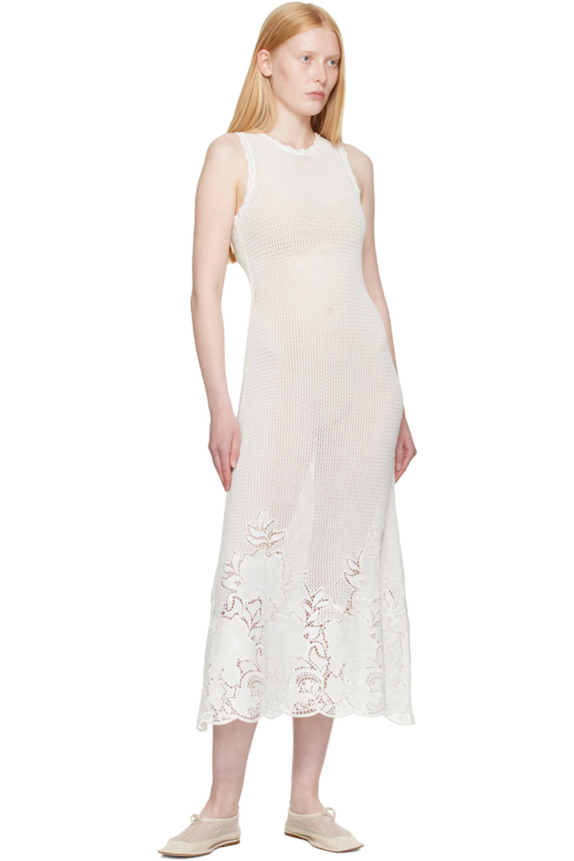 Semi-sheer open-knit mercerized cotton midi dress. Scalloped edges throughout.

· Crewneck
· Broderie anglaise detailing at hem 
· Keyhole with button fastening at back collar

Supplier color: Ivory