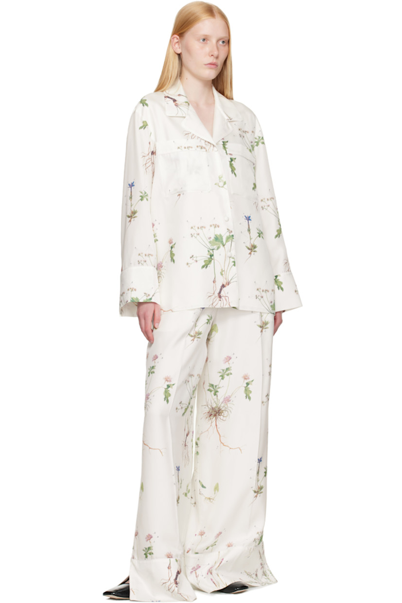 Wide-leg silk twill trousers. Printed floral pattern and piping throughout.

· High-rise
· Two-pocket styling
· Zip fly
· Pleats at front 
· Creased legs
· Vented cuffs
· Full silk voile lining

Supplier color: Botanical violet white