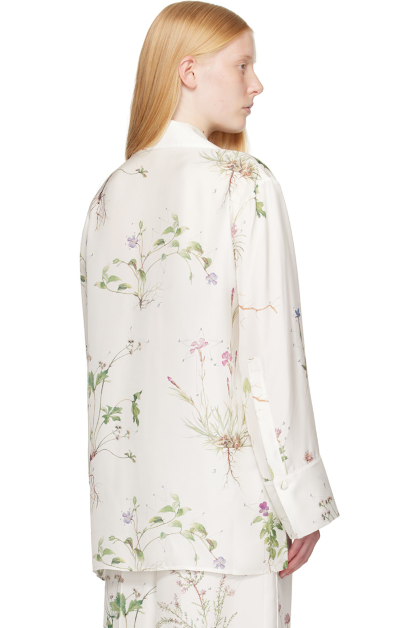 Silk twill shirt. Printed floral pattern and piping throughout.

· Notched lapel
· Button closure
· Patch pockets at chest
· Vented droptail hem
· Dropped shoulders
· Button fastening at vented cuffs

Supplier color: Botanical violet white