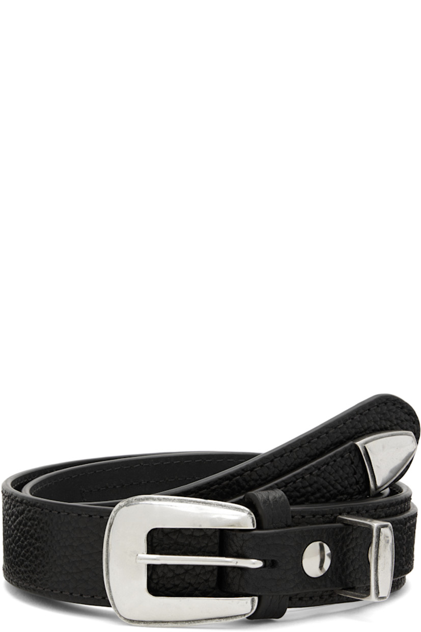 LWG-certified pebble-grained leather belt. 

· Keeper loop hardware and rivets at front 
· Pin-buckle fastening 
· Textured silver-tone hardware 

Supplier color: Black