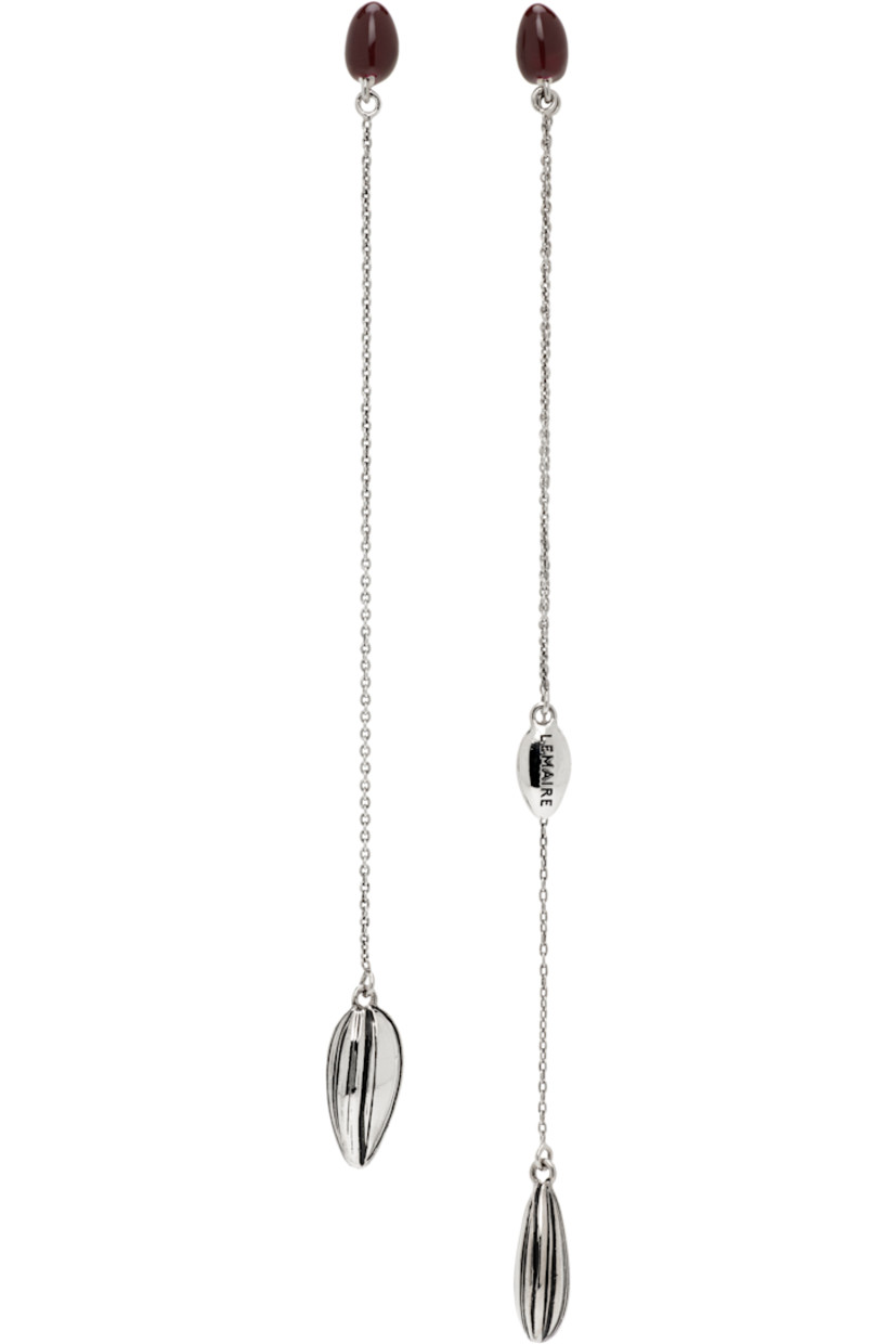 Pair of mismatched drop earrings in silver-tone brass.

· Resin accent in burgundy at face
· Graphic with black enamel stripes at drop
· Post-stud fastening
· H5.5" x W0.5"; H4.5" x W0.5"

Supplier color: Silver