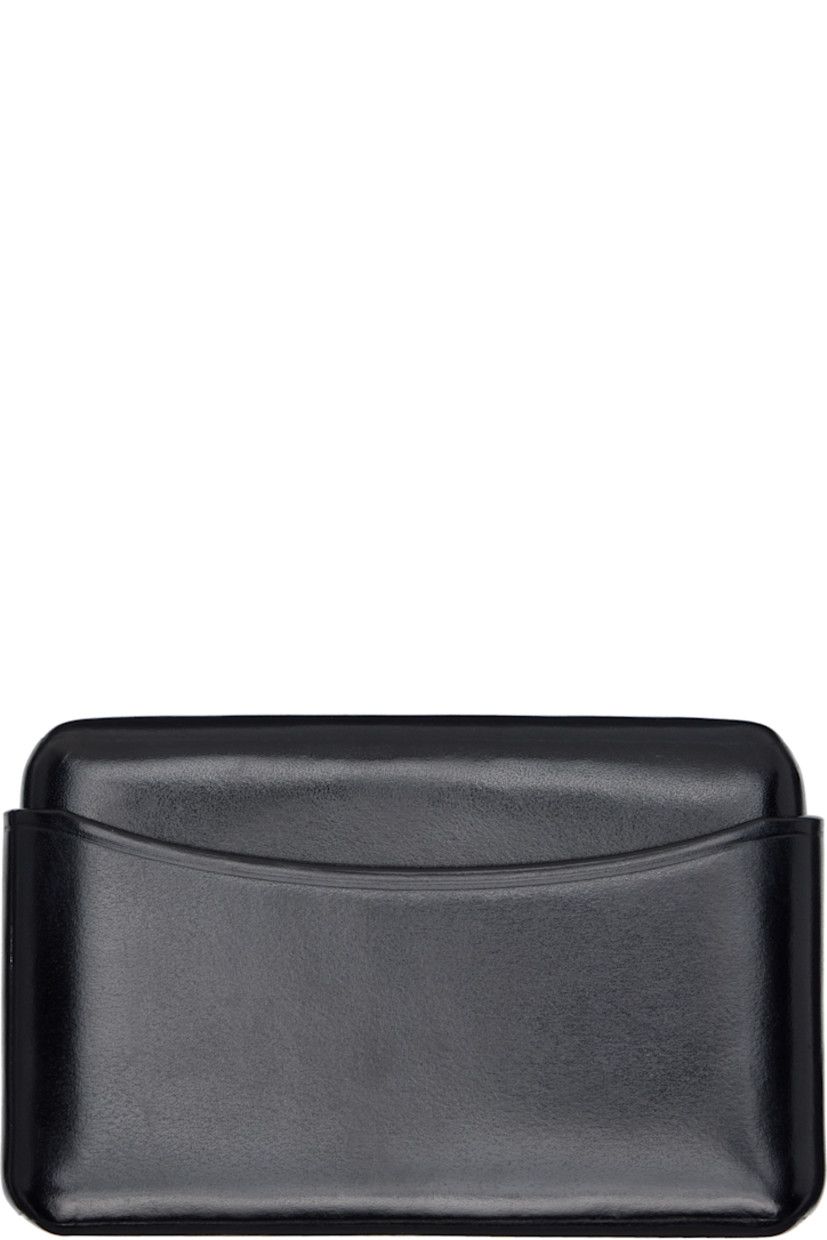 Sheathed two-piece buffed leather card holder.

· LWG-certified leather
· H2.5" x W4" x D0.75"

Supplier color: Black