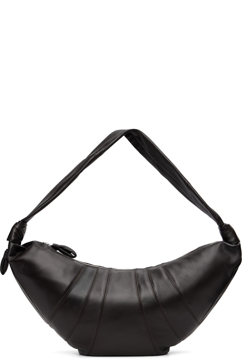 Nappa lambskin shoulder bag.

· Fixed knotted crossbody strap
· Zip pocket with padded pull-tab at side
· Padded pull-tab at zip closure
· Patch pocket at interior
· Detachable zip pouch-on-lanyard at interior
· Cotton canvas lining
· H11" x W23" x D2.5"

Supplier color: Dark chocolate