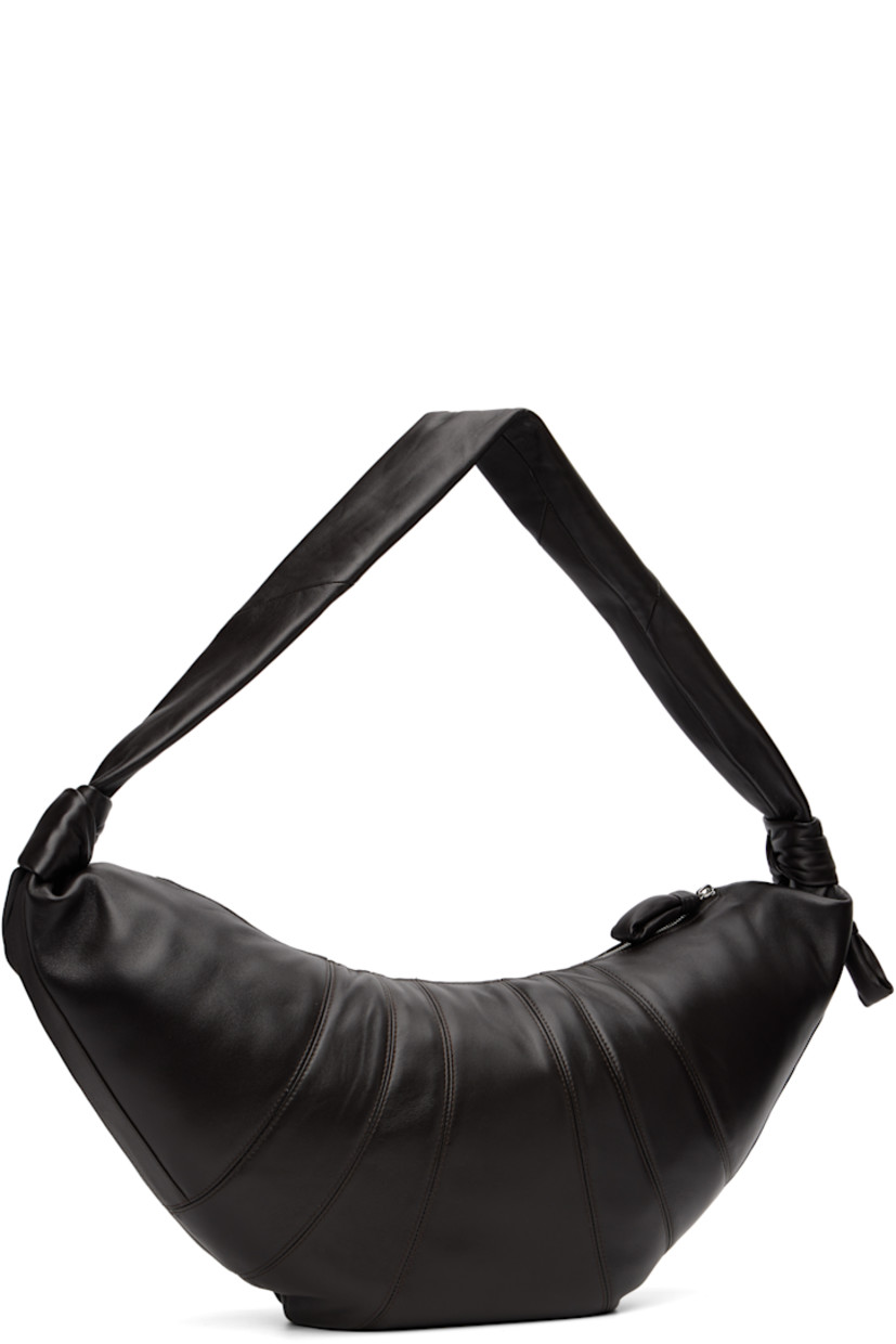 Nappa lambskin shoulder bag.

· Fixed knotted crossbody strap
· Zip pocket with padded pull-tab at side
· Padded pull-tab at zip closure
· Patch pocket at interior
· Detachable zip pouch-on-lanyard at interior
· Cotton canvas lining
· H11" x W23" x D2.5"

Supplier color: Dark chocolate