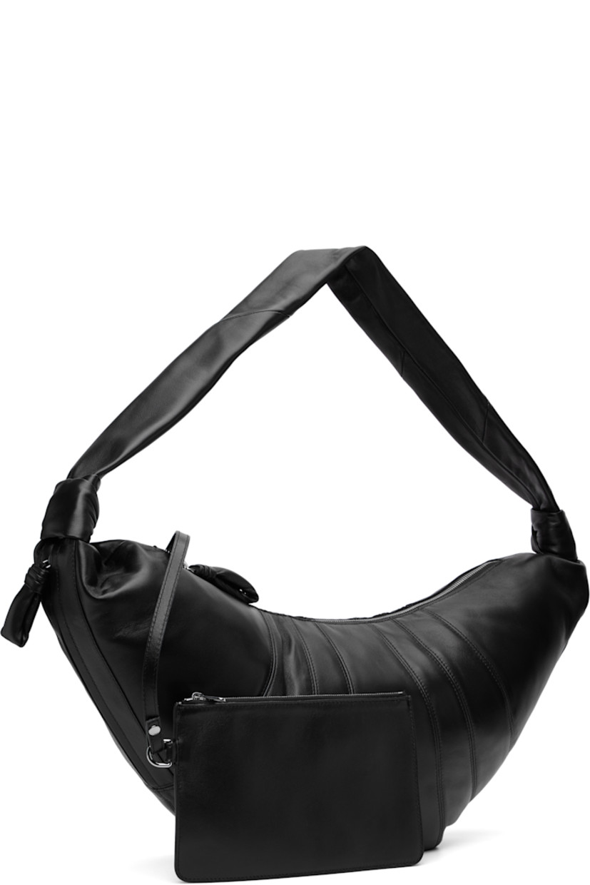 Nappa lambskin shoulder bag.

· Fixed knotted crossbody strap
· Zip pocket with padded pull-tab at side
· Padded pull-tab at zip closure
· Patch pocket at interior
· Detachable zip pouch-on-lanyard at interior
· Cotton canvas lining
· H11" x W23" x D2.5"

Supplier color: Black