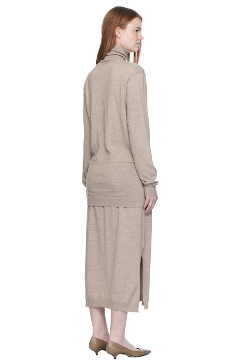 Knit wool-blend midi dress.

· Exposed seams throughout
· Rib-knit turtleneck, hem, and cuffs
· Self-tie sweater-style panel at waist
· Vented side seams

Supplier color: Light taupe
