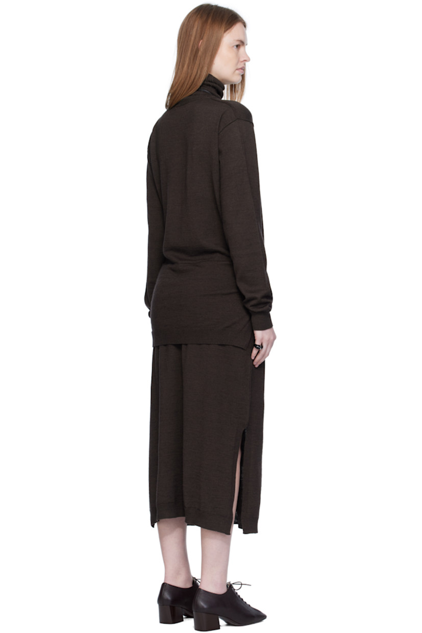 Knit wool-blend midi dress.

· Exposed seams throughout
· Rib-knit turtleneck, hem, and cuffs
· Self-tie sweater-style panel at waist
· Vented side seams

Supplier color: Dark cacao