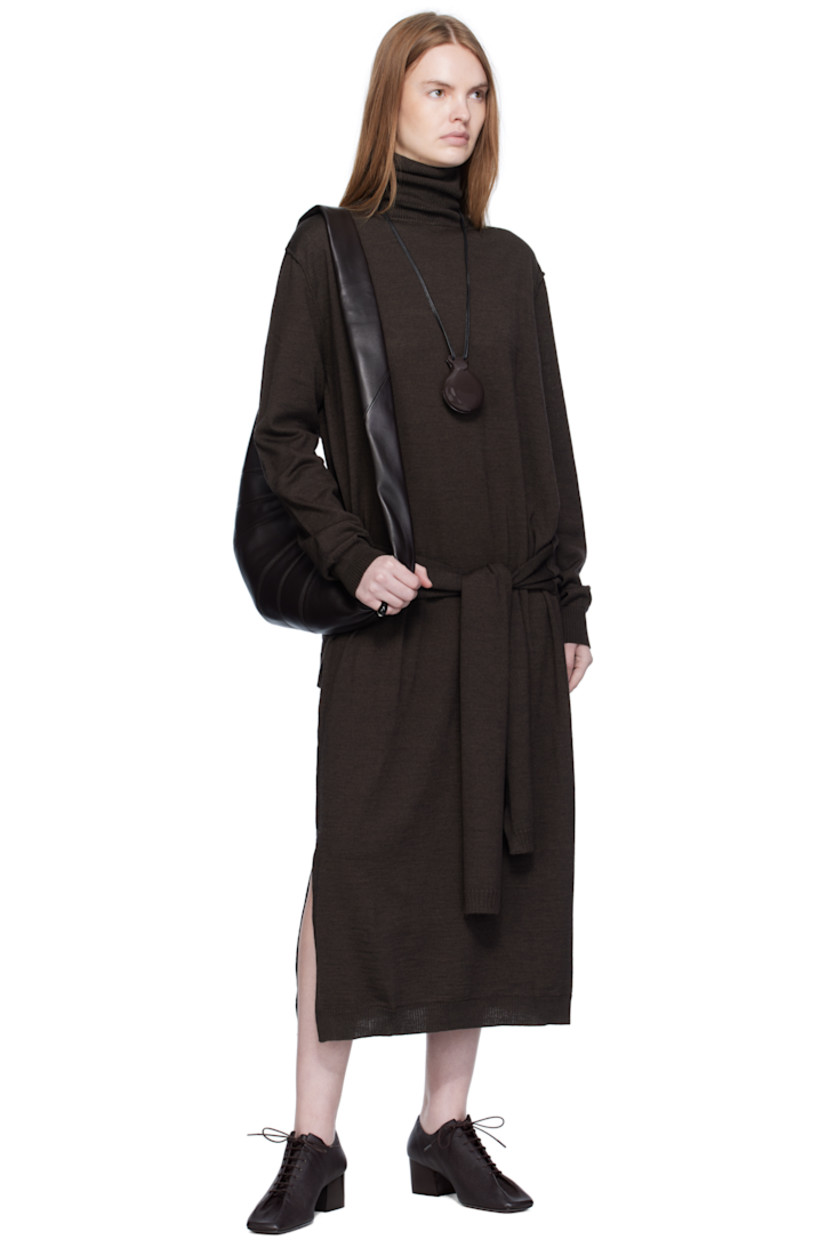 Knit wool-blend midi dress.

· Exposed seams throughout
· Rib-knit turtleneck, hem, and cuffs
· Self-tie sweater-style panel at waist
· Vented side seams

Supplier color: Dark cacao