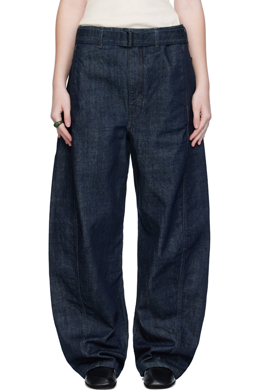 Heavyweight non-stretch denim jeans.

· Fading throughout
· Mid-rise
· Belt loops
· Detachable cinch belt
· Four-pocket styling
· Zip fly
· Twisted outseams
· Leather logo patch at back waistband
· Contrast stitching in brown

Supplier color: Denim indigo