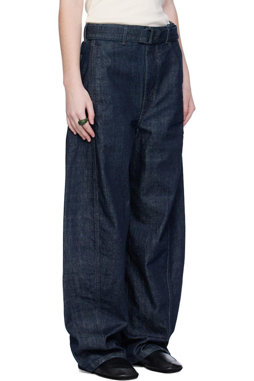 Heavyweight non-stretch denim jeans.

· Fading throughout
· Mid-rise
· Belt loops
· Detachable cinch belt
· Four-pocket styling
· Zip fly
· Twisted outseams
· Leather logo patch at back waistband
· Contrast stitching in brown

Supplier color: Denim indigo
