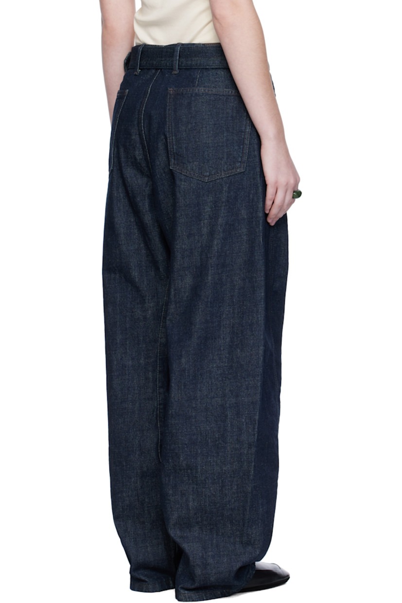Heavyweight non-stretch denim jeans.

· Fading throughout
· Mid-rise
· Belt loops
· Detachable cinch belt
· Four-pocket styling
· Zip fly
· Twisted outseams
· Leather logo patch at back waistband
· Contrast stitching in brown

Supplier color: Denim indigo
