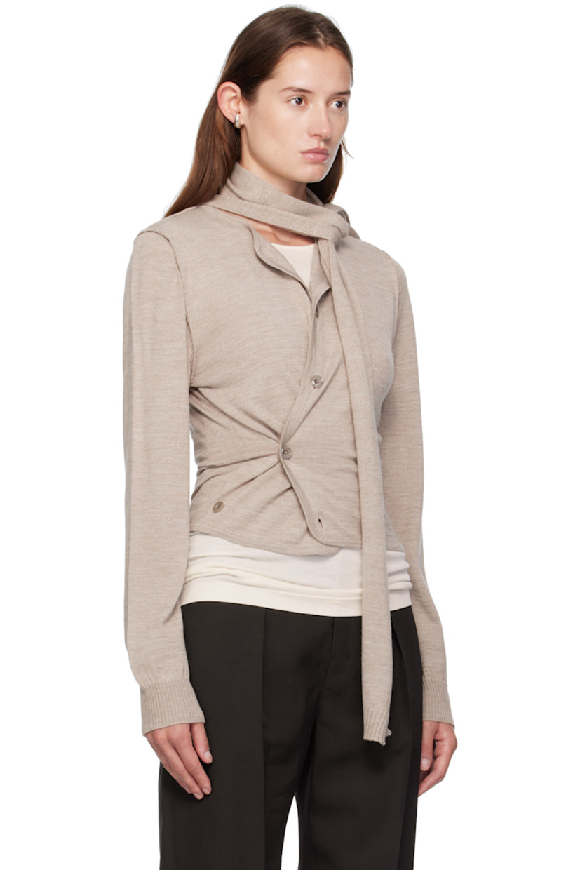 Knit wool-blend cardigan.

· Round neck
· Button closure
· Offset button fastening at side
· Exposed seams at shoulders and back
· Rib-knit cuffs
· Integrated scarf at back

Supplier color: Light taupe