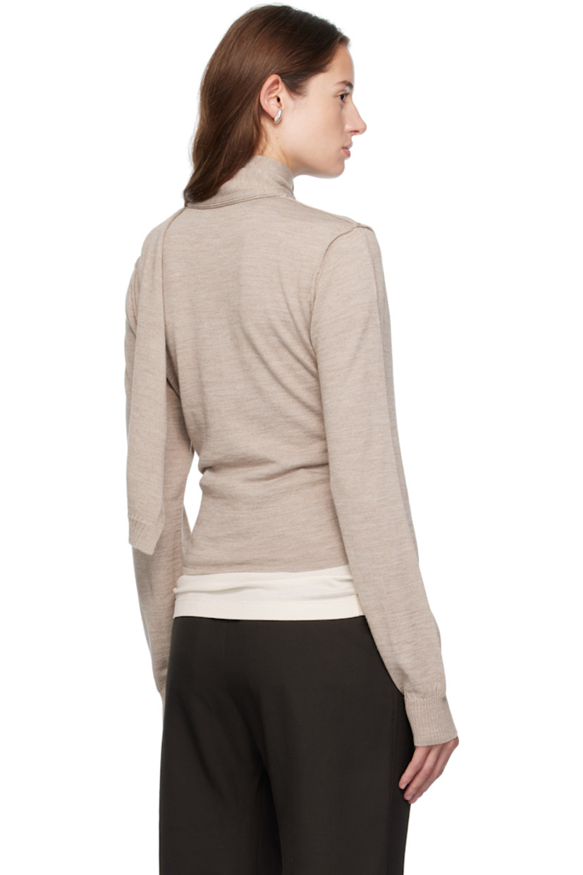 Knit wool-blend cardigan.

· Round neck
· Button closure
· Offset button fastening at side
· Exposed seams at shoulders and back
· Rib-knit cuffs
· Integrated scarf at back

Supplier color: Light taupe