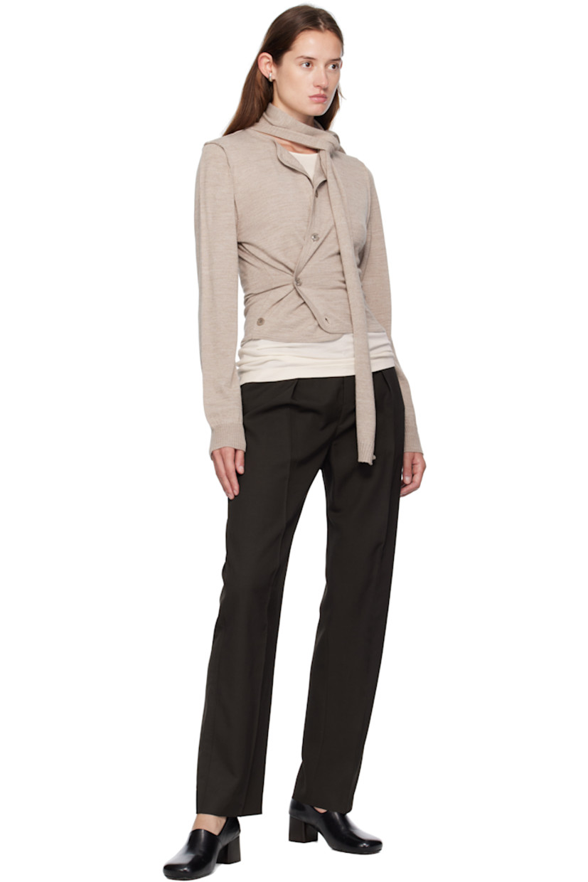 Knit wool-blend cardigan.

· Round neck
· Button closure
· Offset button fastening at side
· Exposed seams at shoulders and back
· Rib-knit cuffs
· Integrated scarf at back

Supplier color: Light taupe