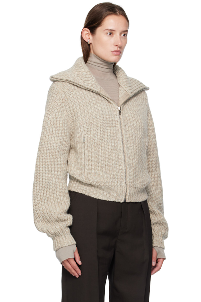 Rib-knit alpaca- and yak wool-blend sweater.

· Funnel neck
· Zip closure
· Zip pockets at waist
· Dropped shoulders

Supplier color: Beige/Oat