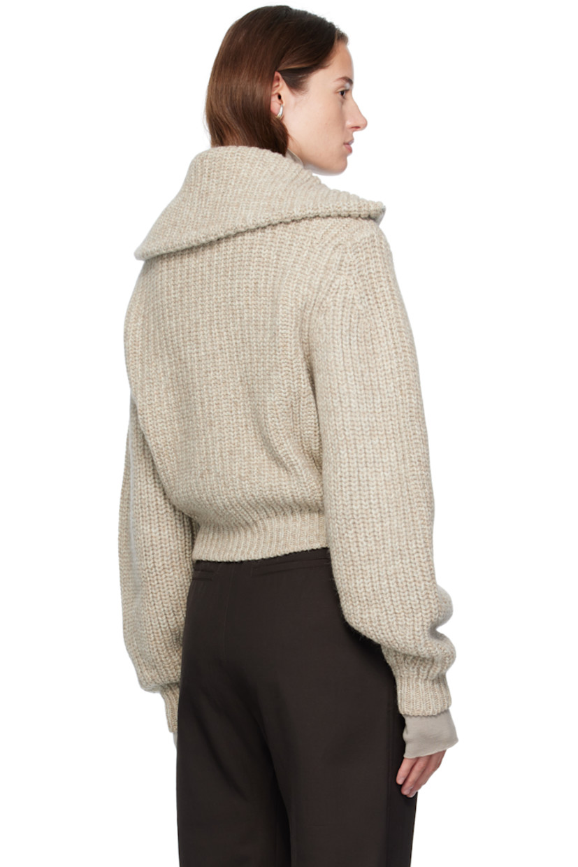 Rib-knit alpaca- and yak wool-blend sweater.

· Funnel neck
· Zip closure
· Zip pockets at waist
· Dropped shoulders

Supplier color: Beige/Oat