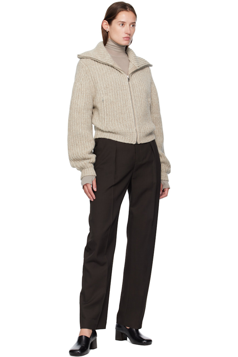 Rib-knit alpaca- and yak wool-blend sweater.

· Funnel neck
· Zip closure
· Zip pockets at waist
· Dropped shoulders

Supplier color: Beige/Oat
