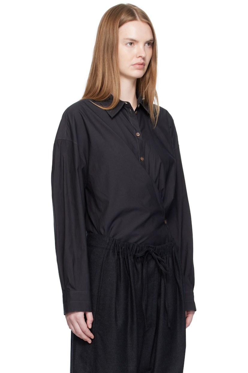 Washed cotton- and silk-blend poplin shirt.

· Spread collar
· Asymmetrical button and self-tie closure
· Dropped shoulders
· Buttoned barrel cuffs
· Gathering at back yoke

Supplier color: Squid ink