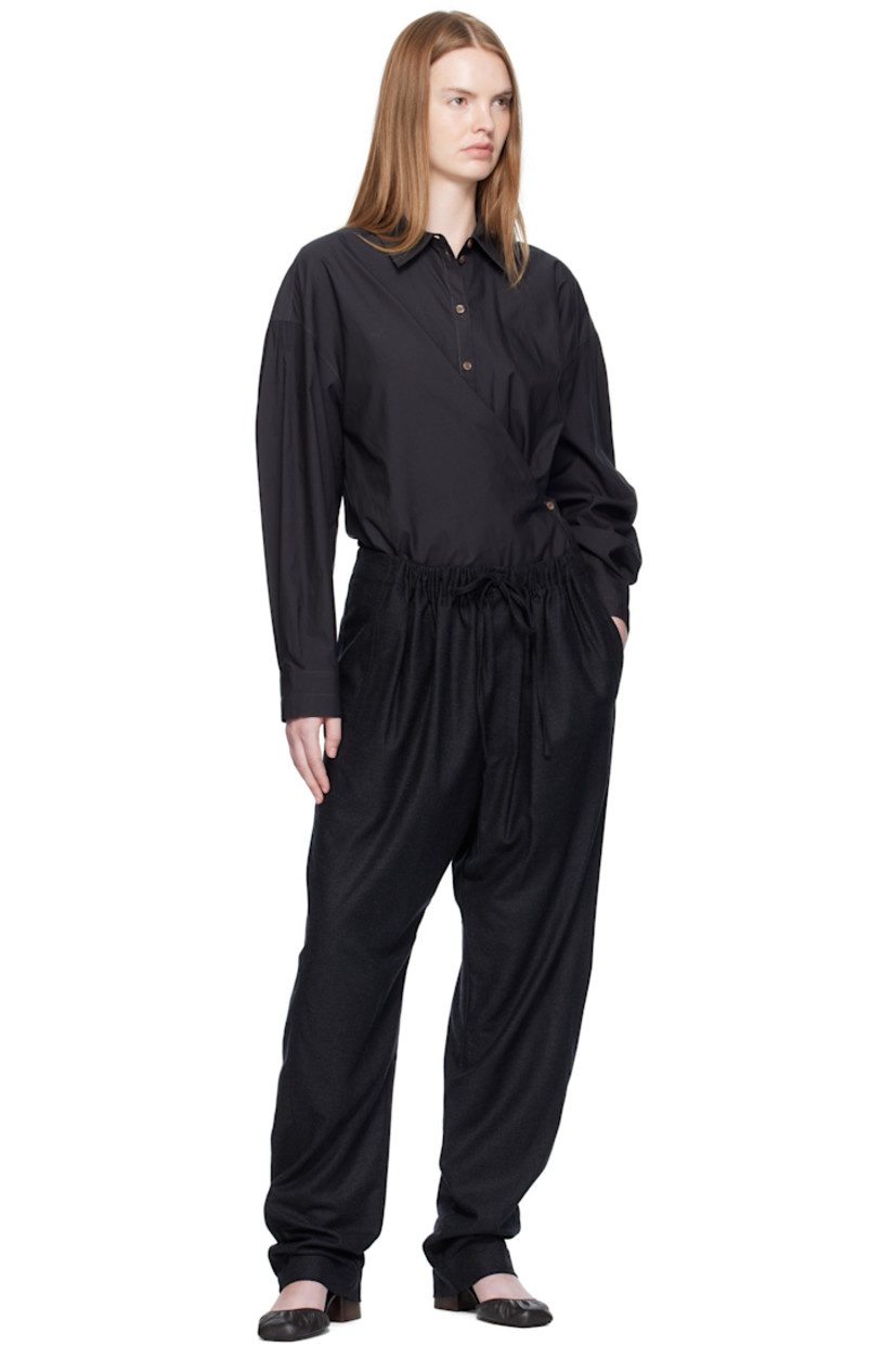 Washed cotton- and silk-blend poplin shirt.

· Spread collar
· Asymmetrical button and self-tie closure
· Dropped shoulders
· Buttoned barrel cuffs
· Gathering at back yoke

Supplier color: Squid ink