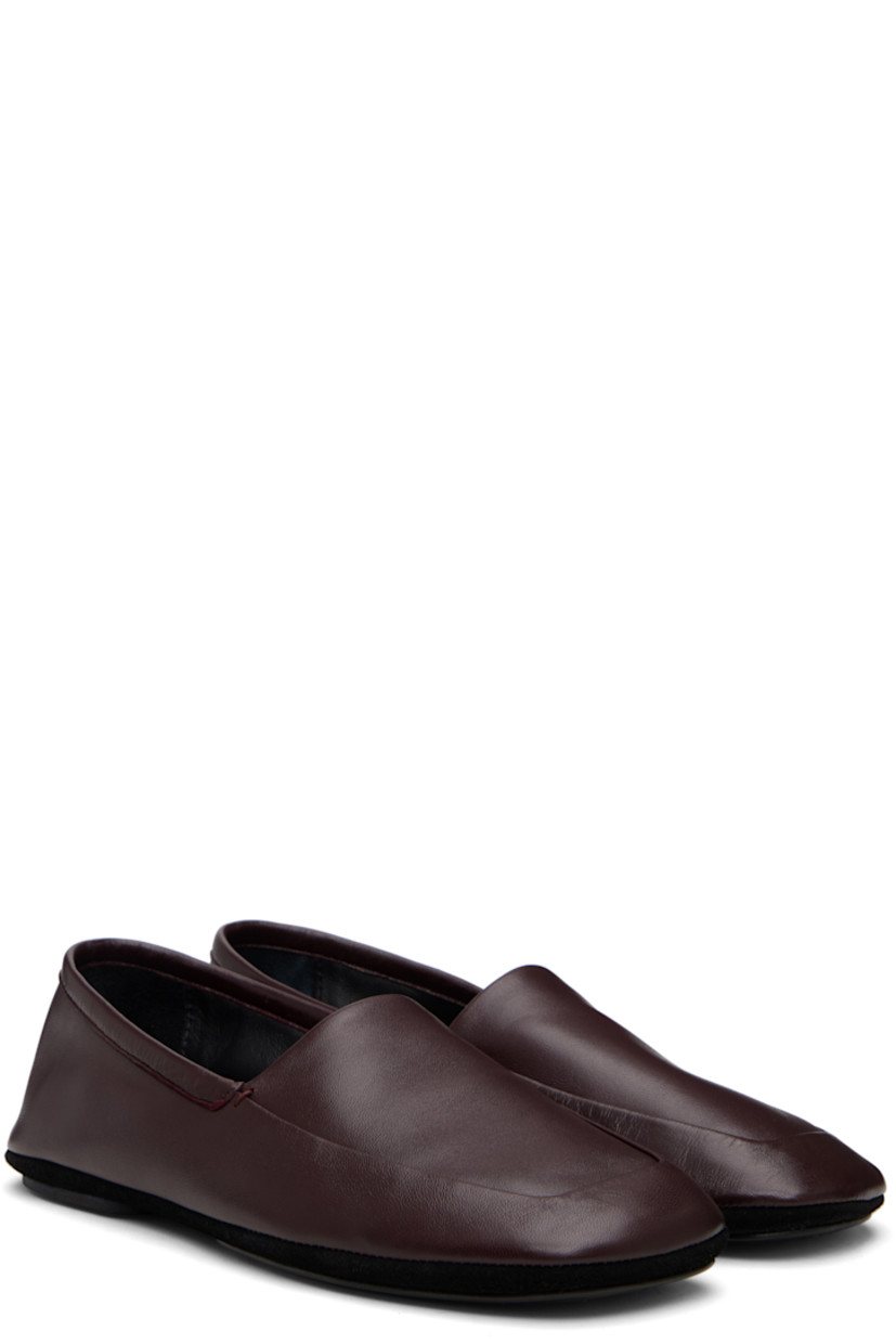 Grained nappa lambskin loafers.

· LWG Gold-certified leather
· Square toe
· Collapsible heel counter
· Leather lining
· Suede midsole
· Leather island sole with rubber heel

Supplier color: Dark Eggplant