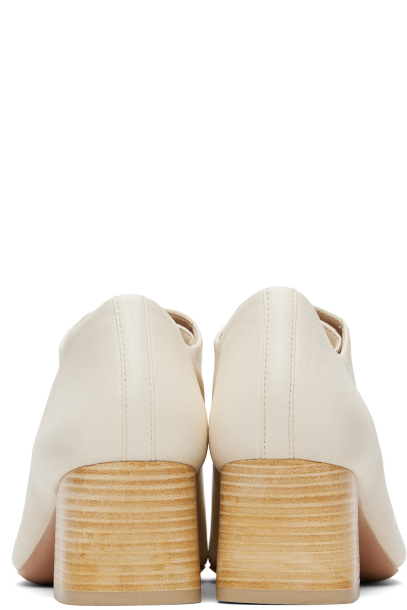 Grained leather heels.

· Square toe
· Lace-up closure
· Stacked leather heel with rubber injection
· Leather sole
· Heel: H2"

Supplier color: White