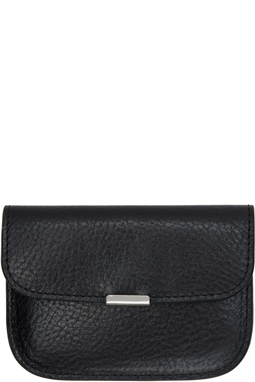 Vegetable-tanned grained leather card holder.

· LWG-certified leather
· Logo embossed at back face
· Press-stud closure
· Two card slots
· H3" x W4.25"

Supplier color: Black