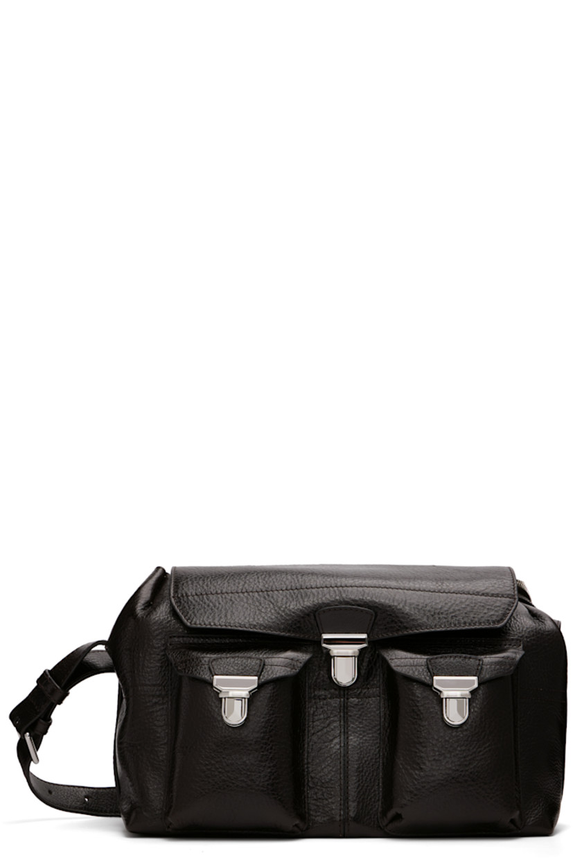 Vegetable-tanned grained leather messenger bag.

· LWG Gold-certified leather
· Adjustable crossbody strap
· Flap pockets at face
· Zip pocket and embossed logo at back face
· Press-release flap
· Zip closure
· Suede lining
· H8.5" x W13" x D7"

Supplier color: Espresso