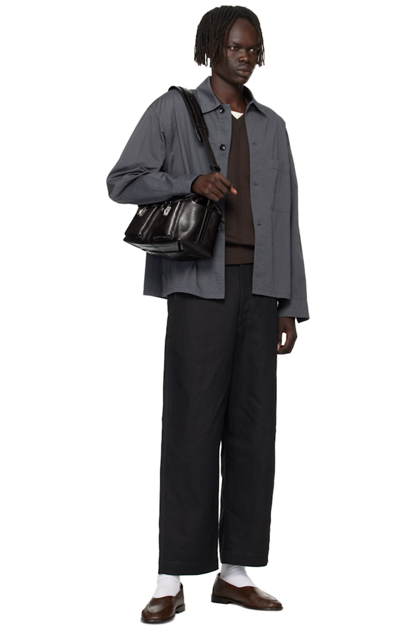 Vegetable-tanned grained leather messenger bag.

· LWG Gold-certified leather
· Adjustable crossbody strap
· Flap pockets at face
· Zip pocket and embossed logo at back face
· Press-release flap
· Zip closure
· Suede lining
· H8.5" x W13" x D7"

Supplier color: Espresso