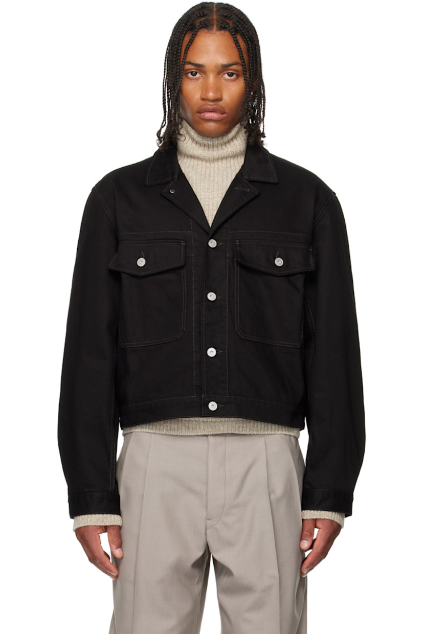 Non-stretch denim jacket. 

· Open spread collar  
· Button closure
· Flap pockets at chest
· Pleats at buttoned barrel cuffs
· Adjustable button tabs at back hem

Supplier color: Black