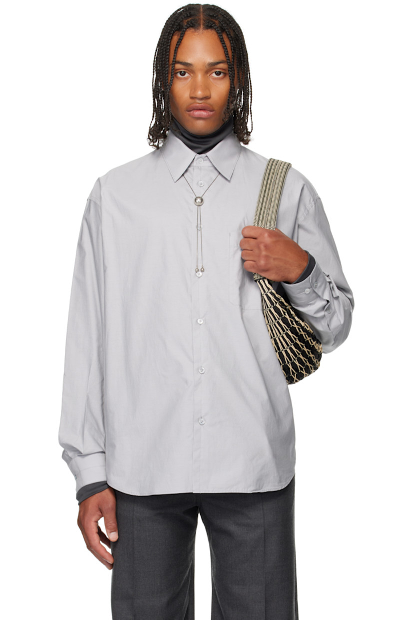 Cotton- and silk-blend poplin shirt.

· Spread collar 
· Button closure
· Patch pocket at chest
· Shirttail hem 
· Buttoned barrel cuffs
· Box pleat at back yoke 

Supplier color: Mist