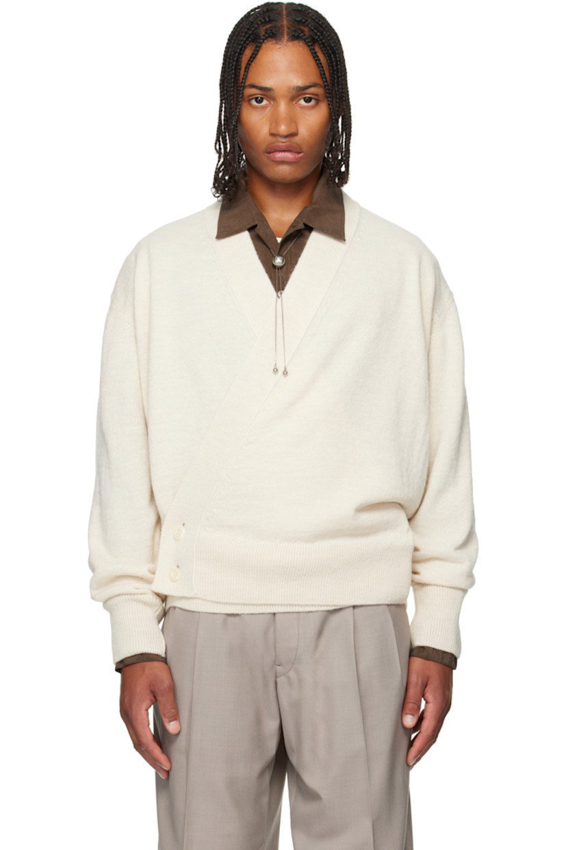 Knit acrylic-blend cardigan.

· Wrap construction 
· Rib-knit placket, hem, and cuffs
· Offset button closure

Supplier color: Light cream