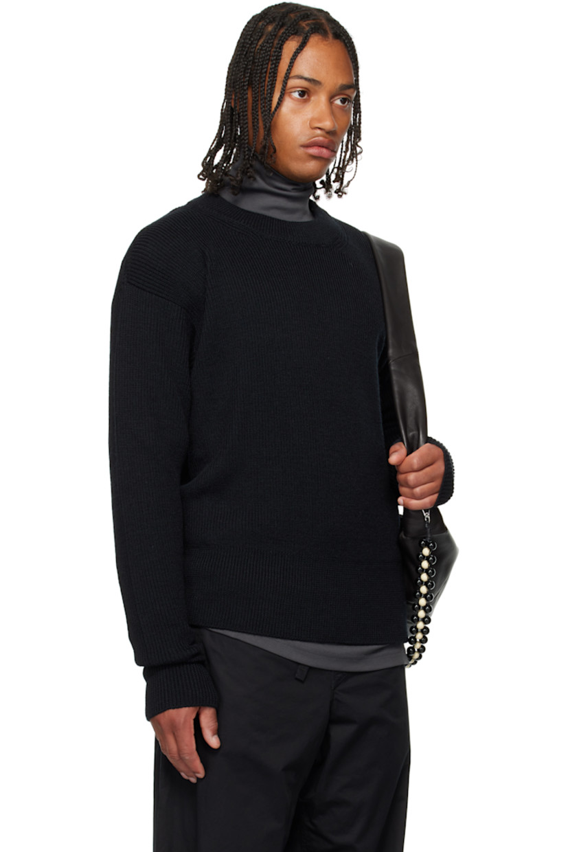 Rib-knit wool sweater. Round neck.

Supplier color: Black
