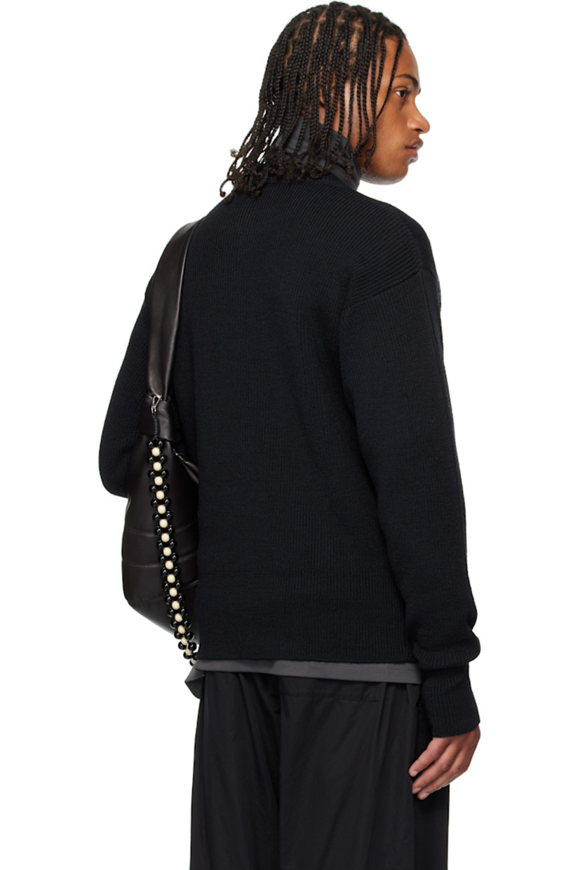 Rib-knit wool sweater. Round neck.

Supplier color: Black